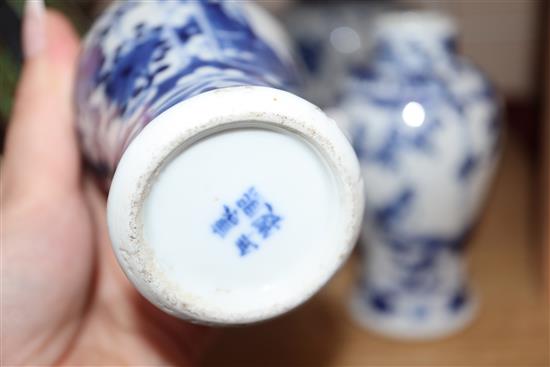 A 19th century Chinese blue and white ovoid jar, wood cover and two similar smaller vases tallest 15cm